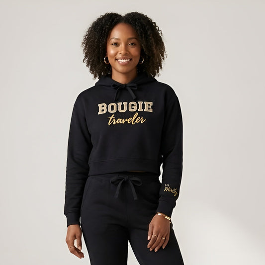 Woman wearing a black hoodie with 'BOUGIE traveler' text on a white background